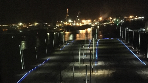 Conference dinner view of the life-size outlines of the Titanic and Olympic main deck’s, illuminated by blue light
