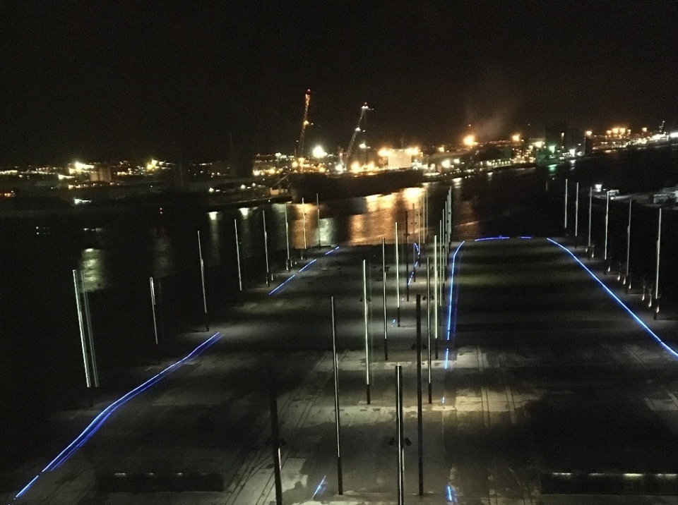 Conference dinner view of the life-size outlines of the Titanic and Olympic main deck’s, illuminated by blue light