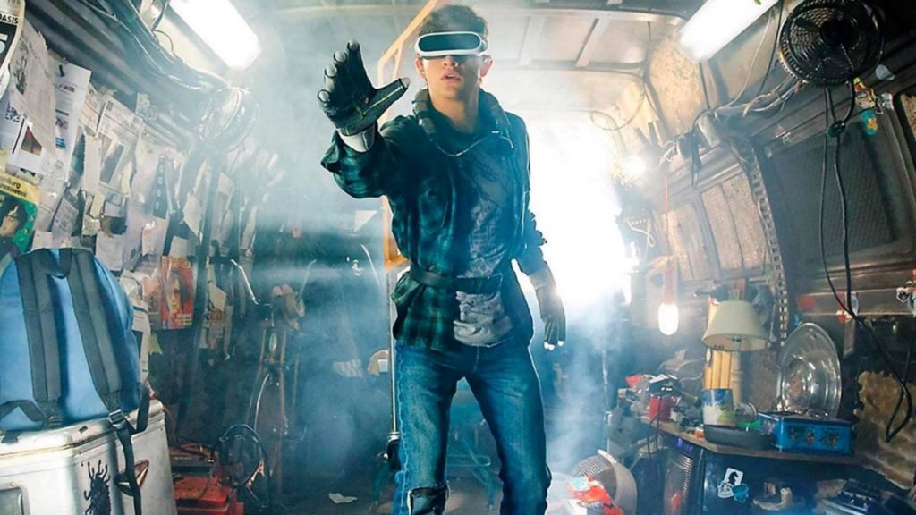 Picture of a young man using virtual reality glasses from the 2018 movie “Ready Player One” from Warner Bros.